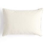 Back side of pillow showing solid off-white fabric without pattern