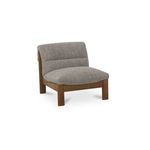 Three-quarter angle view showing slanted foldover back and seat curve of gray Pierce Accent Chair