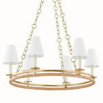 Frontal close-up of chandelier showing texture detail of wrapped rattan lower ring and smooth aged brass upper ring