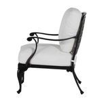 Side profile highlighting gently curved armrest and thick white cushions of lounge chair
