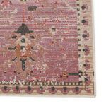 Close-up of corner focusing on intricate floral motif and multicolor woven texture