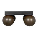 Three quarter angled perspective showing the contrast between matte black top and rounded brass legs