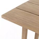 Angled close-up of the table corner showing the join between tabletop panels and one leg