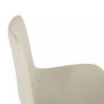 Side view showing curved white faux leather backrest and seat upholstery