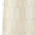 Close-up detail of bone tile pattern on the Osa Drinks Table’s cylindrical stem section