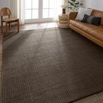 Rug displayed in bright living area with light wood floor, mid-century modern furniture