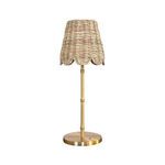 Table lamp shown from slightly higher angle emphasizing scalloped edges of woven rattan shade
