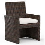 Montecito Dining Chair in rich Cognac multi-colored resin wicker with white seat cushion and armless design