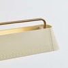 Side close-up showing inside of Soft Sand shade and brass rod on white wall