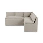 Side angle view showing deep cushioned seats and full back cushions on slipcover fabric