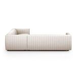 Side profile showing the deep channel tufting wrapping fully around the sofa back