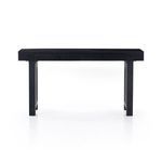 Tilted front side view of Tilda Black Wash Mango Desk highlighting drawer knobs and panel legs
