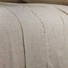 Close-up of frayed edge detail on the bamboo linen sheet showing texture and weave