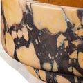 Close-up of the bowl's side showing detailed marble pattern with peach and dark purple contrast