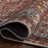 Close-up of Layla Brick / Blue Rug rolled corner showing fabric texture and fine edging stitching