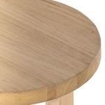 Close-up on gently rounded thick tabletop showing natural wood grain and finish