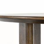 Close-up on softened rounded edge detailing of dark stained mango wood tabletop