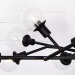 Close detail of individual glass bulb with visible filament and black holder arm