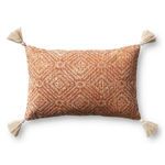 Rectangular orange pillow with white geometric pattern and tassels at each corner