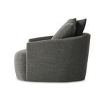 Side view with pillow angles and curved seat cushion with smooth fabric upholstery