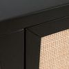 Close-up of black acacia wood corner and edge framing rattan door panel