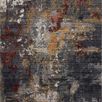 Top-down view of rug showing dense pile texture and abstract color pattern