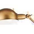 Close-up of antique brass domed lamp shade and joint with lever for angle adjustment