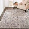 Armant rug shown in a living space with beige armchair and wood floor, illustrating scale and room styling