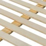 Close-up view of wooden slats that support the mattress inside the upholstered bed frame