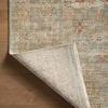 Back side of Heritage Aqua Terracotta rug with one corner folded to reveal backing texture