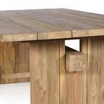Close-up detail of side apron joinery exposing natural wood grain and stretcher beam end