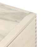 Close-up of trunk top corner showing mitered wood joints and fine light finish