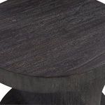 Close-up of the carbonized suar wood texture on the rounded edge of Berkely Round Side Table top