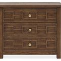Bachelor's chest front view emphasizing symmetrical geometric drawer design and brass knobs