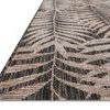 Close-up angled view showing woven texture and detailed leaf pattern edges on rug
