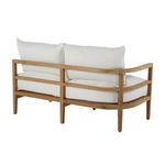 Opposite rear three-quarter view showing curved teak backrail and plush white cushions