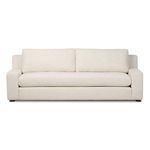 Front low-angle view emphasizing sofa height, cushion depth, and upholstery detail