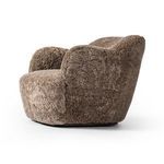 Julius Swivel Chair side view illustrating plush rounded form and swivel base