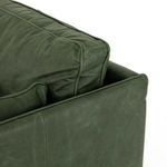 Side view emphasizing back cushion height and leather arm with crisp piping