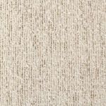 Close-up view of beige boucle fabric with dense, looped texture and speckled detail