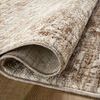 Rug partially rolled to reveal the soft, power-loomed polyester pile and woven backing texture
