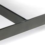 Close-up on leather bench corner showing subtle aged effect and black metal bracket