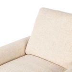 Close-up of cushioned seat and backrest with visible fabric weave and soft padding