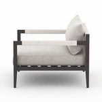 Side view of Sherwood chair focusing on rope-wrapped armrests and plush cushion depth