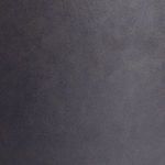 Close-up of the matte black ceramic surface texture with subtle handmade finish details