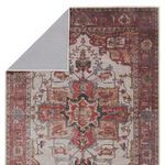 Rug corner flipped to reveal solid beige fabric backing and precise edge stitching