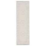 Gray and white modern runner rug with high-low texture, medallion center and scrolling border detail