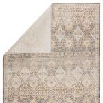 Folded corner highlights contrast between rug’s distressed pattern and smooth underside