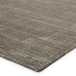 Close-up of rug corner highlighting thin linear pattern and soft pile texture