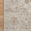 Close-up of rug corner with detailed floral motifs on light wood floor